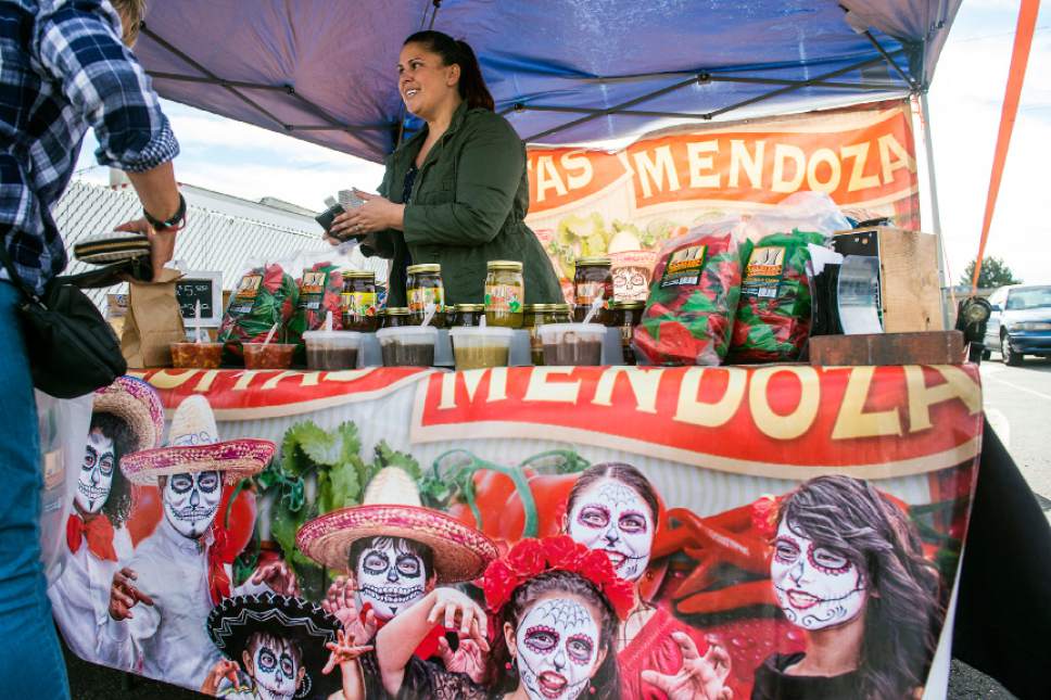 Chris Detrick  |  The Salt Lake Tribune
Linnaea Mendoza, of  Salsitas Mendoza, talks with customers during a handmade artisan market at Urban Farm and Feed in Sandy Saturday November 26, 2016.