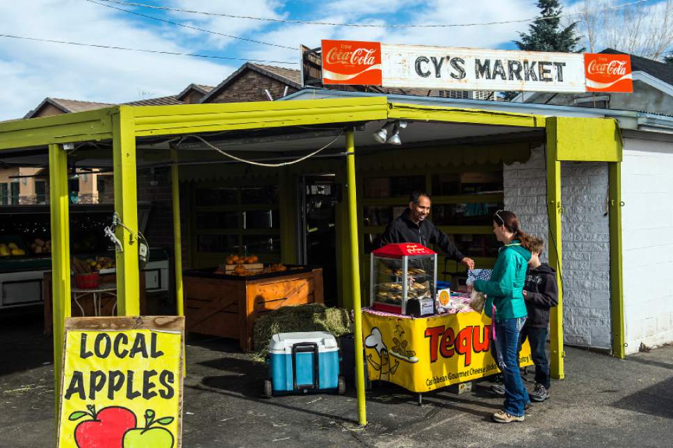 Chris Detrick  |  The Salt Lake Tribune
Raul Rivero, of TequeÒos Factory, sells Venezuelan food during a handmade artisan market at Urban Farm and Feed in Sandy on Saturday.