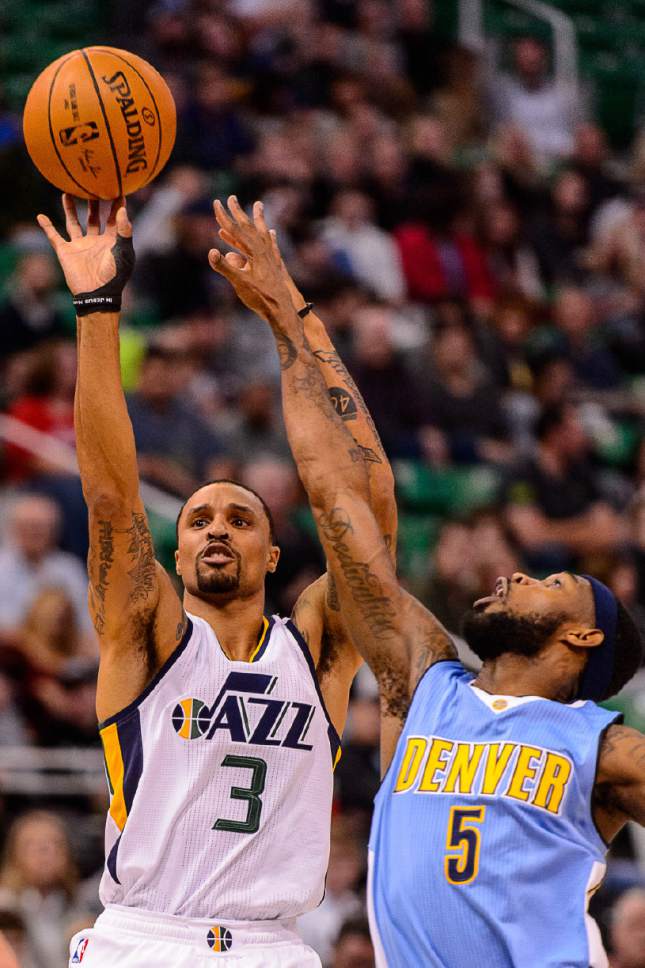 Trent Nelson  |  The Salt Lake Tribune
Utah Jazz guard George Hill (3) shoots with Denver Nuggets guard Will Barton (5) defending as the Utah Jazz host the Denver Nuggets in Salt Lake City, Wednesday November 23, 2016.