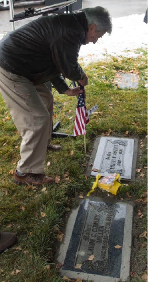 Steve Griffin / The Salt Lake Tribune


At the graveside of his parents, Lavon and Samuel Cowley, Sam Cowley places a flag at his father's gravesite after speaking about his father's life and eventual death as Special Agent for the FBI as the Utah Chapter of the Society of Former Special Agents of the FBI holds a memorial service for Cowley, who died Nov. 28, 1934, from wounds suffered in a gun battle with notorious bank robber Lester Gillis, known as Baby Face Nelson. Cowley was born in Idaho and received a degree from the Utah Agricultural College in Logan. Service was held at the Wasatch Lawn Memorial Park in Salt Lake City Monday November 28, 2016.