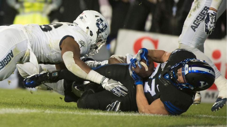 Rick Egan  |  The Salt Lake Tribune

Brigham Young Cougars wide receiver Mitchell Juergens (87) stretches over the  end zone for a touchdown pass, in football action, BYU vs Utah State, at Lavell Edwards Stadium in Provo,  Saturday, November 26, 2016.