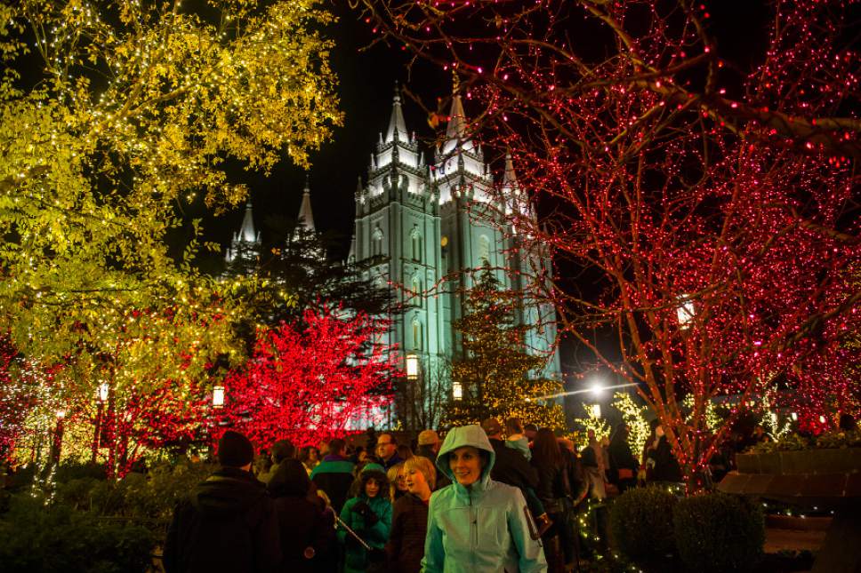 Chris Detrick  |  The Salt Lake Tribune
Visitors look at Christmas Lights on Temple Square Friday November 25, 2016. The Christmas lights will turn on every night at dusk until January 3, 2016.