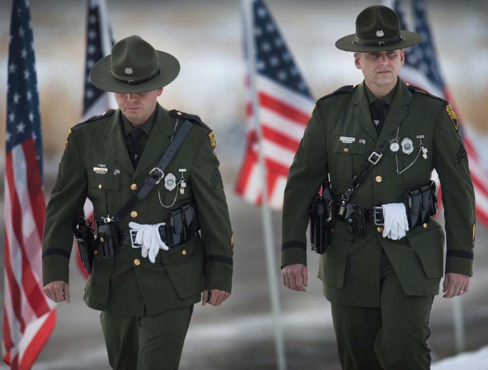 Leah Hogsten  |  The Salt Lake Tribune
l-r West Virginia State Police Sgt. Tim Weese and Sgt. Mike Dickerson joined officers from Louisiana, North Carolina, New York, Wisconsin and Colorado to pay their respects to the family of Utah Highway Patrol Trooper Eric Ellsworth at the Willard LDS Stake Center, November 29, 2016.  Ellsworth was hit by a car on the night of November 18, 2016 while trying to alert the driver of a semitrailer truck to go around a downed power line in Box Elder County. He died four days later.