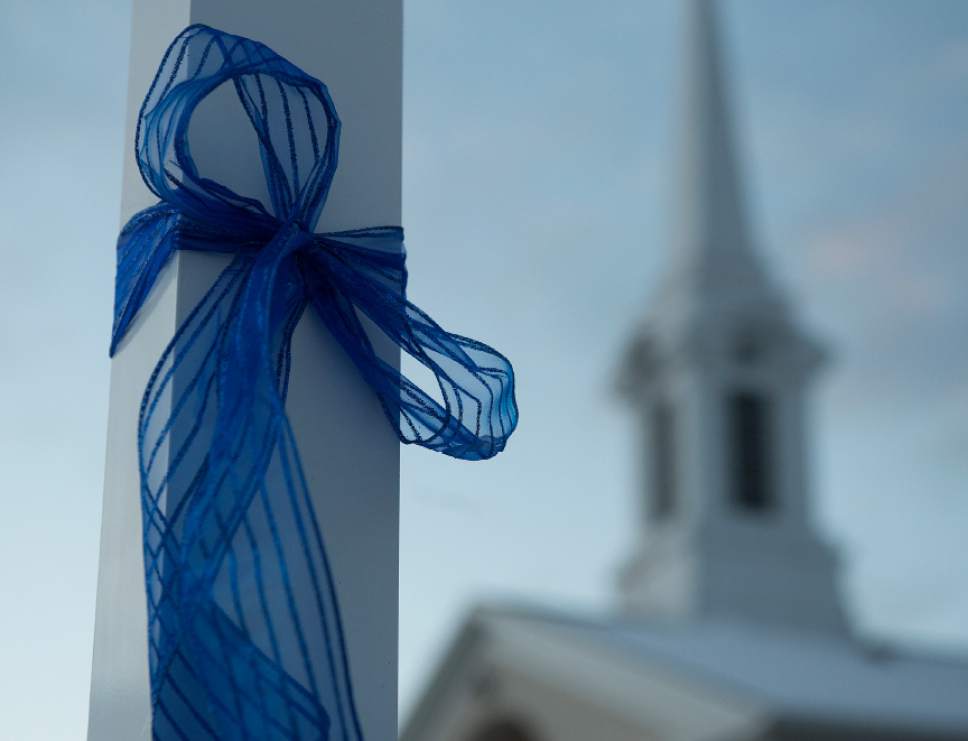 Leah Hogsten  |  The Salt Lake Tribune
Blue ribbons adorn the Willard LDS Stake Center, as friends, loved ones and police officers from Utah and several U.S. state agencies arrive to pay their respects to the family of Utah Highway Patrol Trooper Eric Ellsworth, who was hit by a car on the night of November 18, 2016 while trying to alert the driver of a semitrailer truck to go around a downed power line in Box Elder County. Ellsworth died four days later.