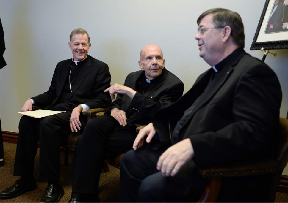 Francisco Kjolseth  |  The Salt Lake Tribune 
Bishop John C Wester, left, speaks with Monsignor J. Terrence Fitzgerald, center, and Colin F. Bircumshaw, during a press conference where Bishop Wester discussed his recent appointment to New Mexico after serving in Utah since 2007.