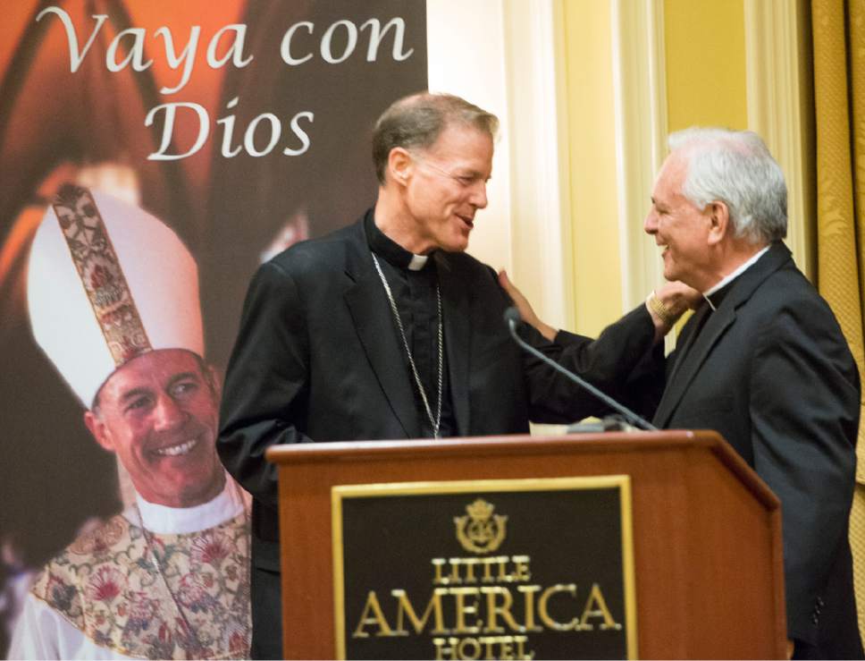 Rick Egan  |  The Salt Lake Tribune
Archbishop John C. Wester shakes hands with the Rev. Martin Diaz, pastor  of the Cathedral of the Madeleine, at a reception at the Little America on Sunday, May 31, 2015.