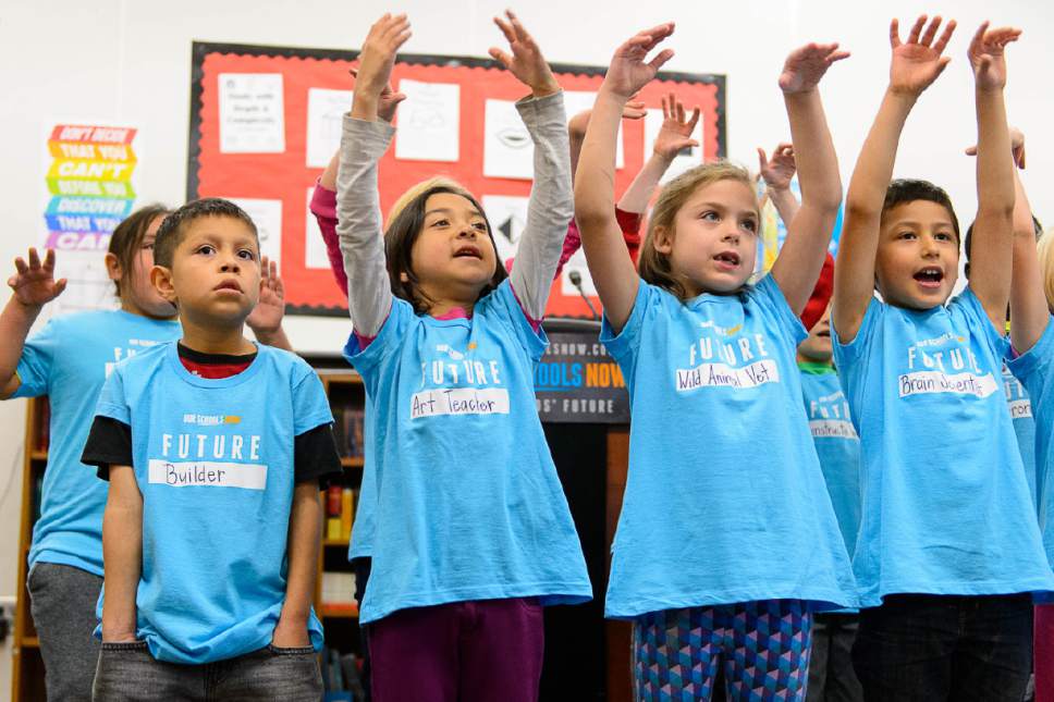 Trent Nelson  |  The Salt Lake Tribune
Second graders at Washington Elementary School sing a song at a press conference announcing the launch of a ballot initiative for an income tax increase to fund schools during the 2018 election, Tuesday November 29, 2016.