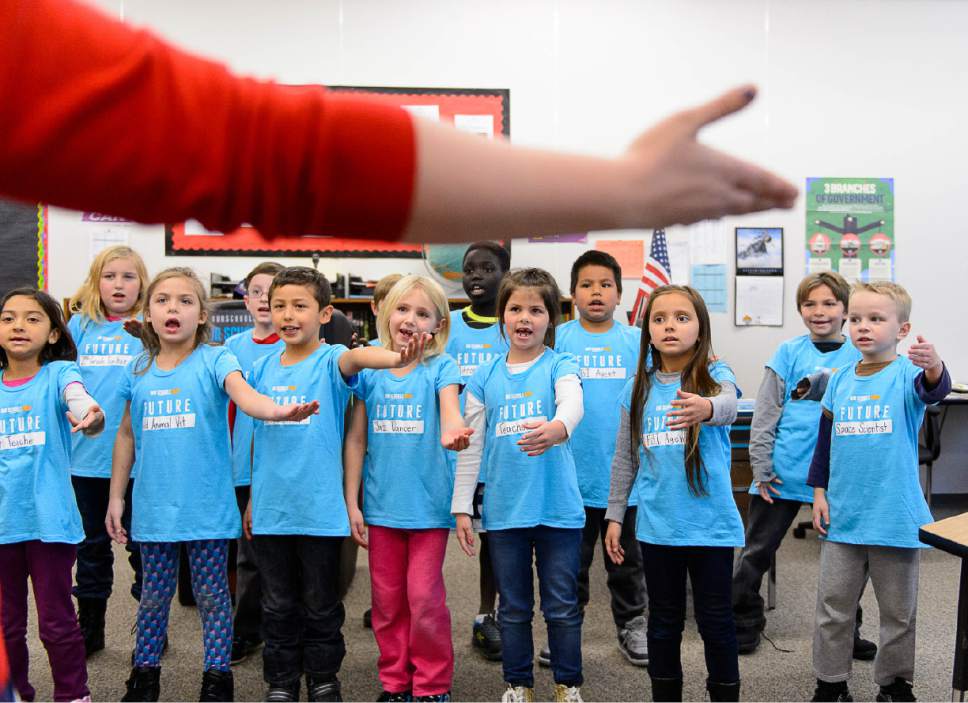 Trent Nelson  |  The Salt Lake Tribune
Second graders at Washington Elementary School sing a song at a press conference announcing the launch of a ballot initiative for an income tax increase to fund schools during the 2018 election, Tuesday November 29, 2016.