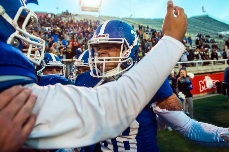 Chris Detrick  |  The Salt Lake Tribune
Bingham's Cole Moody (38) celebrates with his teammates after winning the 5A football championship at Rice-Eccles Stadium Friday November 18, 2016. Bingham defeated Lone Peak 17-10.