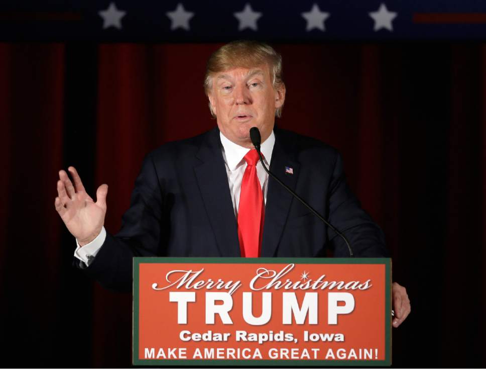 FILE - In this Dec. 19, 2015, file photo, Republican presidential candidate Donald Trump speaks in Cedar Rapids, Iowa. Americans place a higher priority on preserving the religious freedom of Christians than other faith groups, ranking Muslims as the least deserving of the protections, according to a new poll from The Associated Press-NORC Center for Public Affairs Research. The poll was conducted Dec. 10 through Dec. 13, after Islamic extremist attacks in Paris and San Bernardino, California, and during intensifying anti-Muslim rhetoric by Trump and other candidates for the Republican presidential nomination. (AP Photo/Charlie Neibergall)