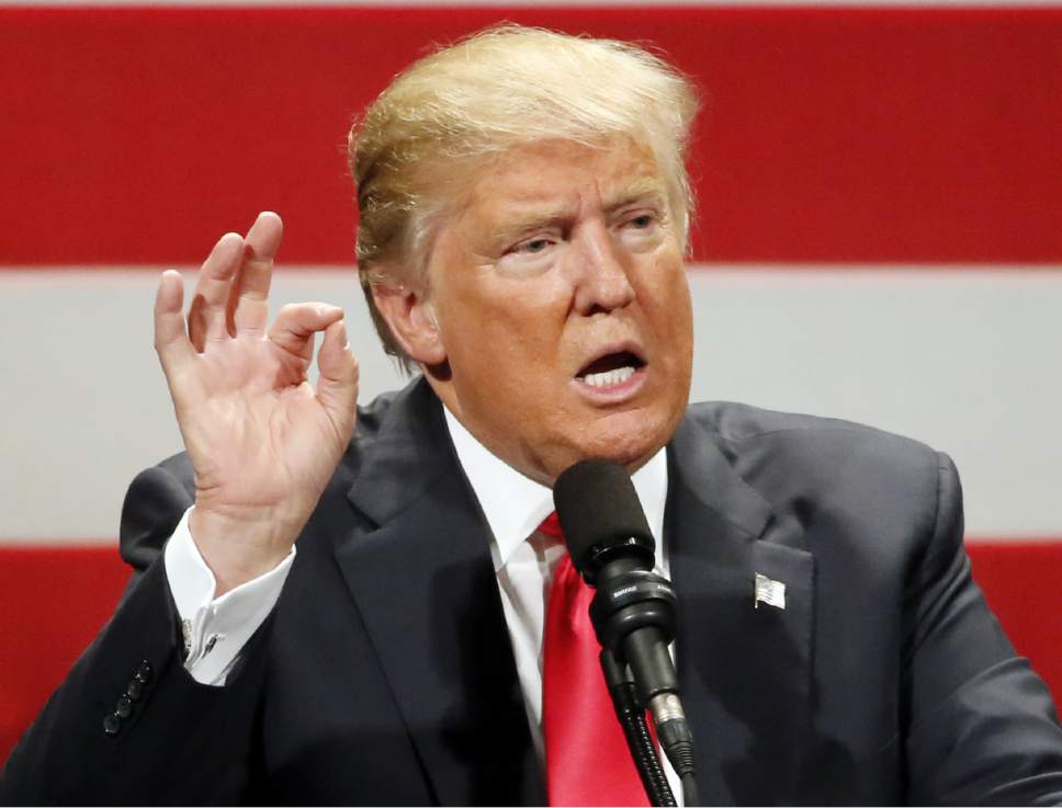 FILE - In this April 4, 2016 file photo, Republican presidential candidate Donald Trump speaks in Milwaukee. Fifty-five percent of Americans say they have a negative opinion of Democratic front-runner Hillary Clinton. But that's not nearly as bad as how they view the leading candidate for the Republican nomination, Donald Trump. (AP Photo/Charles Rex Arbogast)