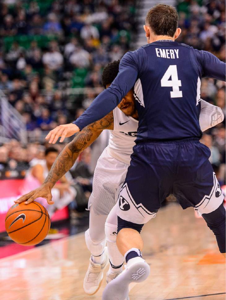 Trent Nelson  |  The Salt Lake Tribune
Utah State Aggies guard Shane Rector (0) commits an offensive foul on Brigham Young Cougars guard Nick Emery (4) as BYU faces Utah State, NCAA basketball in Salt Lake City, Wednesday November 30, 2016.