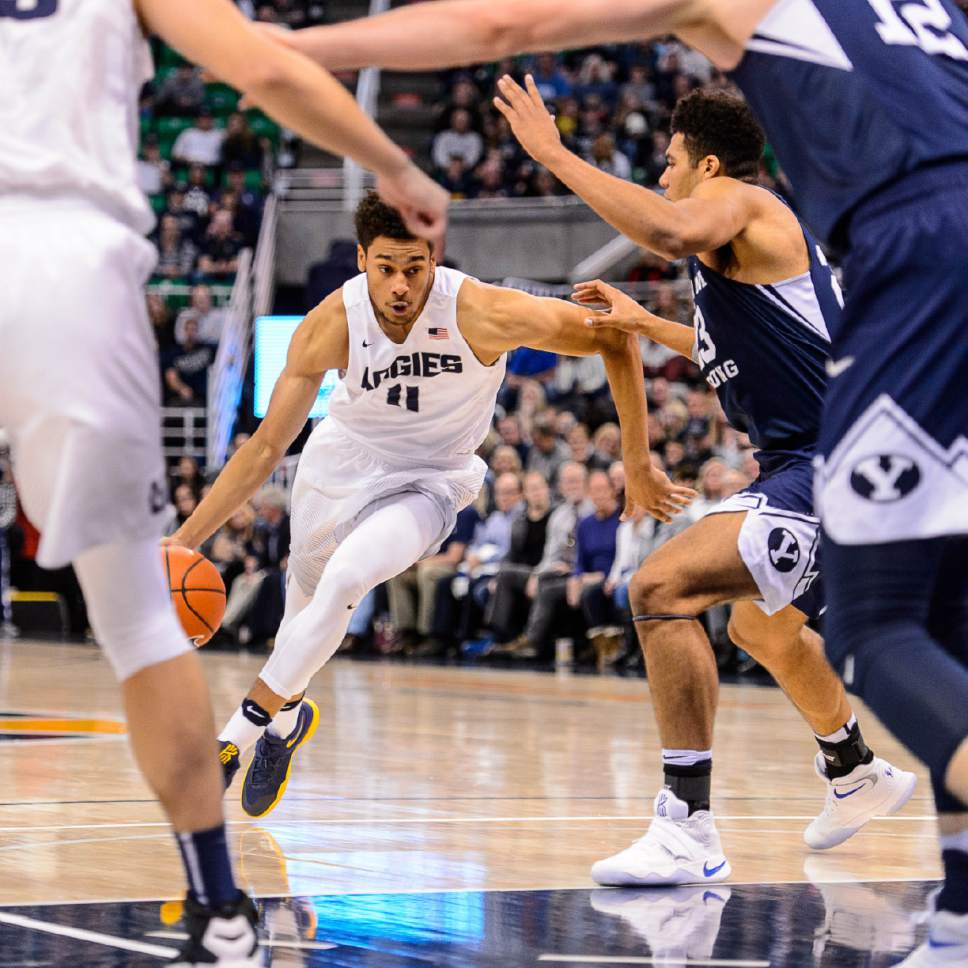 Trent Nelson  |  The Salt Lake Tribune
Utah State Aggies forward Alexis Dargenton (11) drives to the basket as BYU faces Utah State, NCAA basketball in Salt Lake City, Wednesday November 30, 2016.