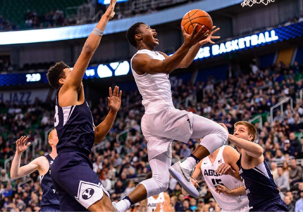 Trent Nelson  |  The Salt Lake Tribune
Utah State Aggies guard Koby McEwen (1) drives to the basket as BYU faces Utah State, NCAA basketball in Salt Lake City, Wednesday November 30, 2016.