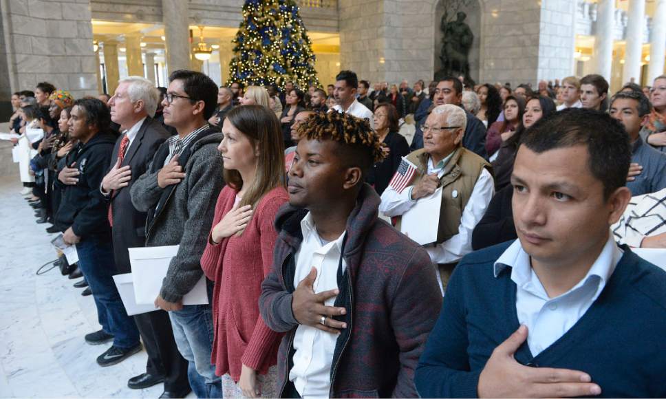 Al Hartmann  |  The Salt Lake Tribune
101 people from 43 countries stand for the National Anthem with hands over their hearts at a Naturalization Ceremony Wednesday, November 30 at the Utah State Capitol.  They later took the Oath of Allegiance to make them new American citizens.