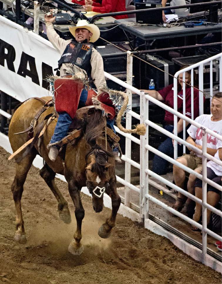 Lennie Mahler  |  The Salt Lake Tribune

Cody Wright of Milford competes in the saddle bronc riding event in the Days of '47 Rodeo at EnergySolutions Arena, Saturday, July 25, 2015.