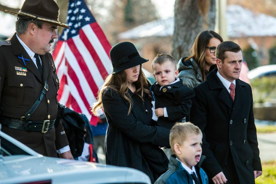 Chris Detrick  |  The Salt Lake Tribune
Janica Ellsworth arrives with family and friends during the burial of Utah Highway Patrol Trooper Eric Ellsworth at Brigham City Cemetery Wednesday November 30, 2016. Ellsworth was hit by a car on the night of November 18, 2016 while trying to alert the driver of a semitrailer truck to go around a downed power line in Box Elder County. He died four days later.