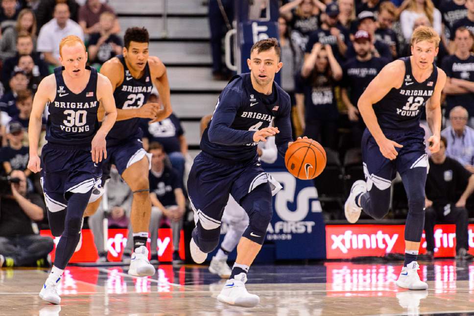 Trent Nelson  |  The Salt Lake Tribune
Brigham Young Cougars guard Nick Emery (4) handles the ball, with guard TJ Haws (30), forward Yoeli Childs (23) and forward Eric Mika (12) flanking him, as BYU faces Utah State, NCAA basketball in Salt Lake City, Wednesday November 30, 2016.