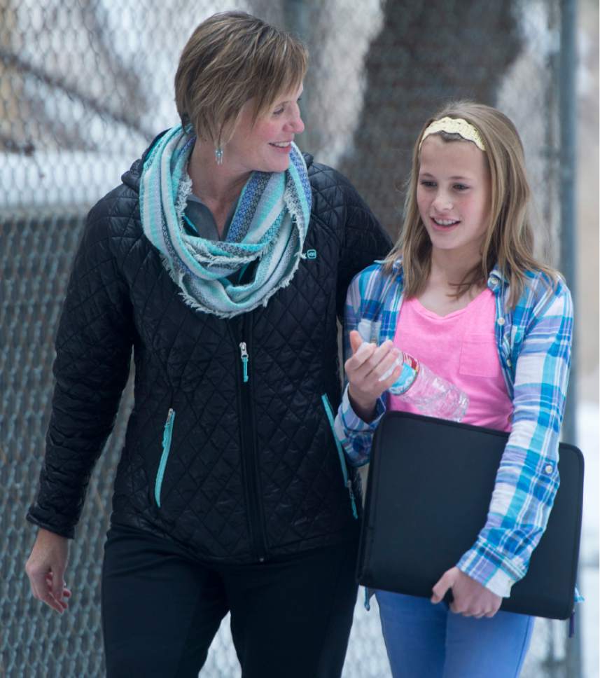 Rick Egan  |  The Salt Lake Tribune

Mary Ann Wilkinson walks with her daughter Sarah, a 7th grader student at Mueller Park Jr High, in Bountiful, where there was a shooting this morning, Thursday, December 1, 2016.