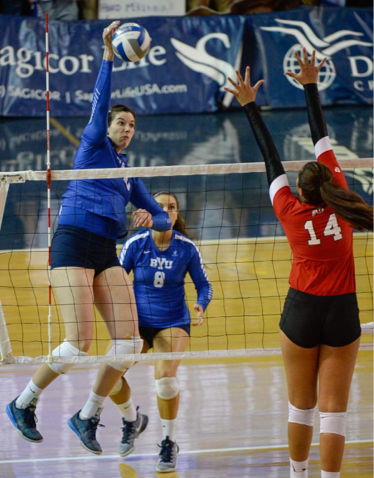 Francisco Kjolseth | The Salt Lake Tribune
Amy Boswell of BYU spikes the ball as she tries to get past Adora Anae of Utah in women's volleyball at the Smith Fieldhouse in Provo on Thursday, Sept. 15, 2016.