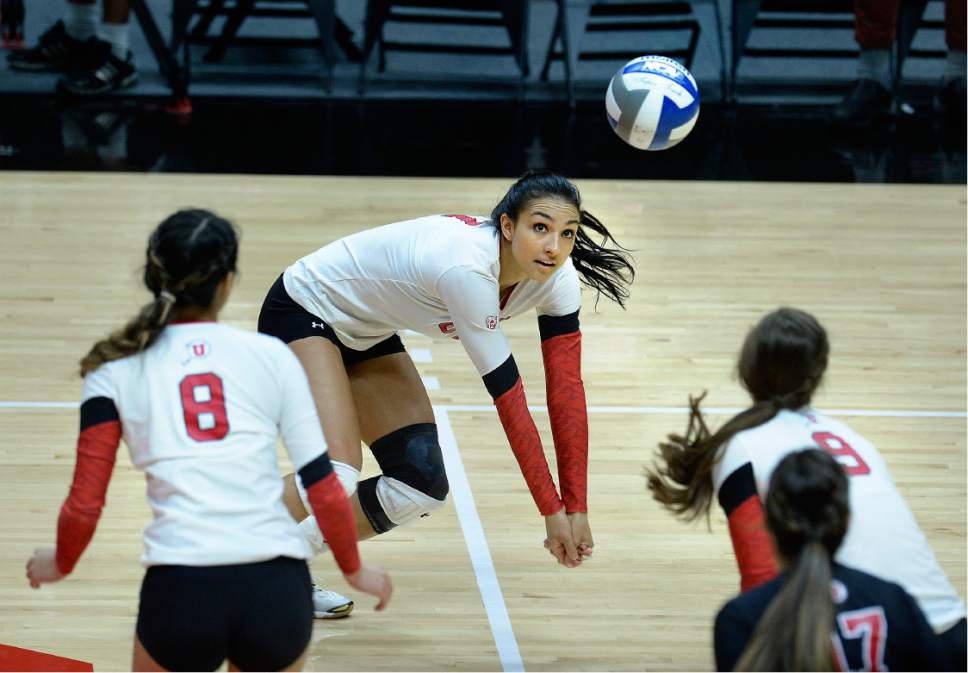 Scott Sommerdorf   |  The Salt Lake Tribune  
Utah's Eliza Katoa digs one for Utah as they salvaged a win in the second game. No. 8 Washington defeated Utah 3-1, Sunday November 19, 2016.