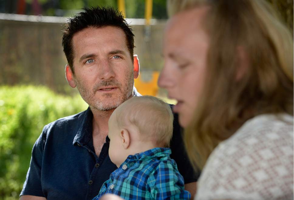 Scott Sommerdorf   |  The Salt Lake Tribune  
Jayson Orvis holds his adopted son during a visit to the home of the baby's  birth mother, Kim Hawkins, Wednesday, September 28, 2016. Hawkins was charged with first-degree murder in the death of her 13-month-old son, Billy Hawkins, despite her attorneys' assertion that there was no evidence she killed the boy. After more than a year in jail awaiting trial, she pleaded guilty to a misdemeanor and was released but still insists that she's innocent.