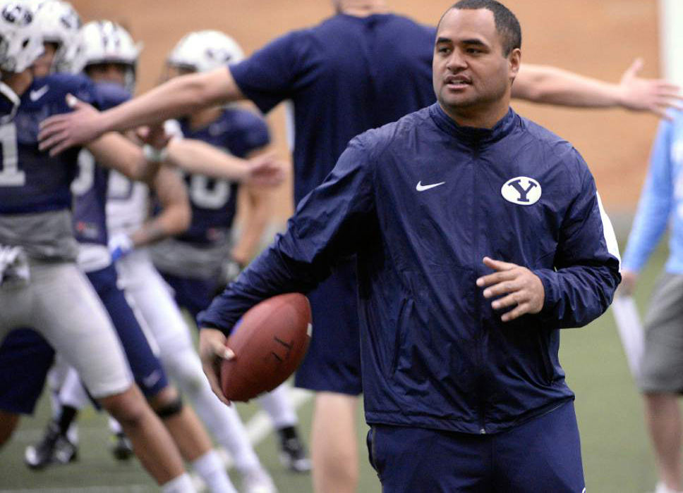 Al Hartmann  |  The Salt Lake Tribune
BYU's new running back coach Reno Mahe works with his players during practice Tuesday March 22.