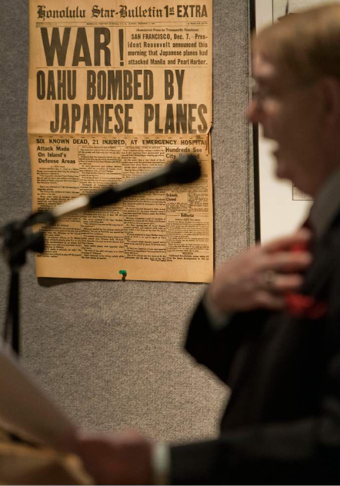 Michael Mangum  |  Special to the Tribune

With a replica of the first extra edition of the Sunday, December 7th, 1941 Honolulu Star-Bulletin front page hanging, Dr. Tucker Davis, son of Lt. Emmett "Cyclone" Davis, a Utahn who served in the Army Air Force during World War II, speaks during a Pearl Harbor commemoration program at the Fort Douglas Museum in Salt Lake City on Saturday, December 3rd, 2016.