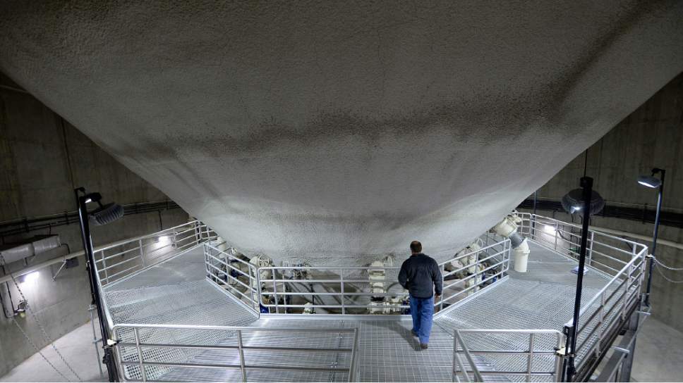 Al Hartmann  |  The Salt Lake Tribune
Phil Heck, Assistant General Manager at the Central Valley Water Reclamation Facilty, is dwarfed by the size of one of the egg digesters that processes sewage solid waste. The two egg digesters were built in the 90's and are working well and not in need of replacement. The 30-year-old Central Valley Water Reclamation Facilty that serves five districts and two municipalities is in need of upgrades that will cost an estimated $250 million and that means fee hikes are coming for tens of thousands of Salt Lake Valley residents and businesses.