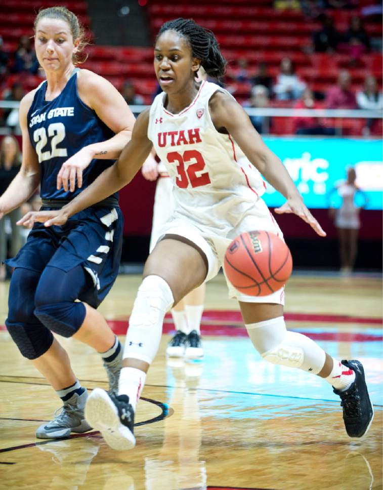 Lennie Mahler  |  The Salt Lake Tribune

Utah's Tanaeya Boclair drives past Utah State's Rachel Brewster in a game at the Huntsman Center in Salt Lake City, Saturday, Dec. 3, 2016.