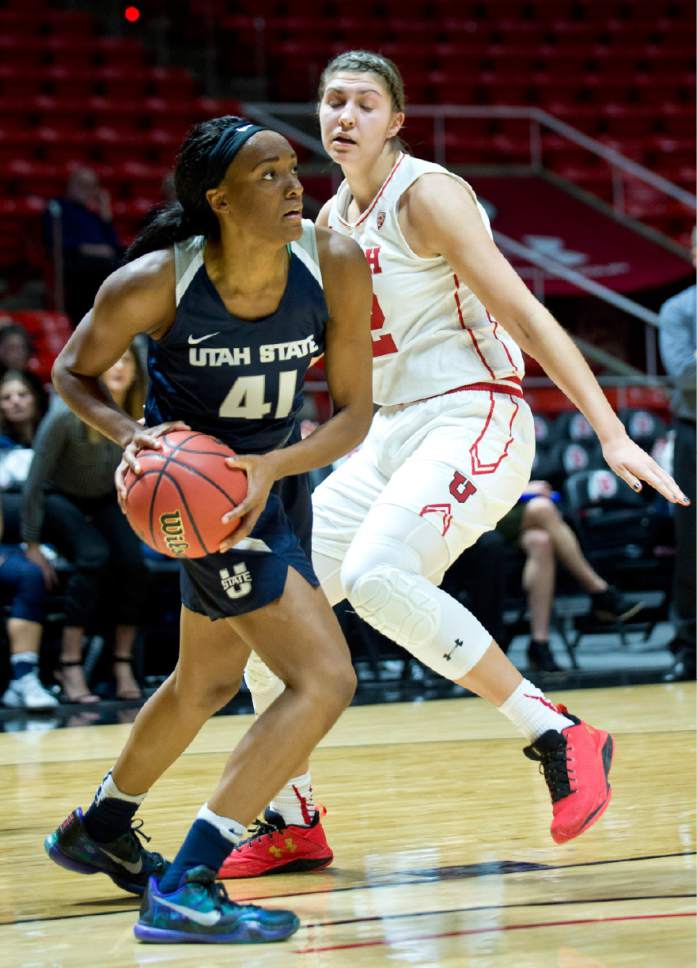 Lennie Mahler  |  The Salt Lake Tribune

Utah State forward Antoina Robinson looks for an outlet pass as Utah's Emily Potter defends in a game at the Huntsman Center in Salt Lake City, Saturday, Dec. 3, 2016.