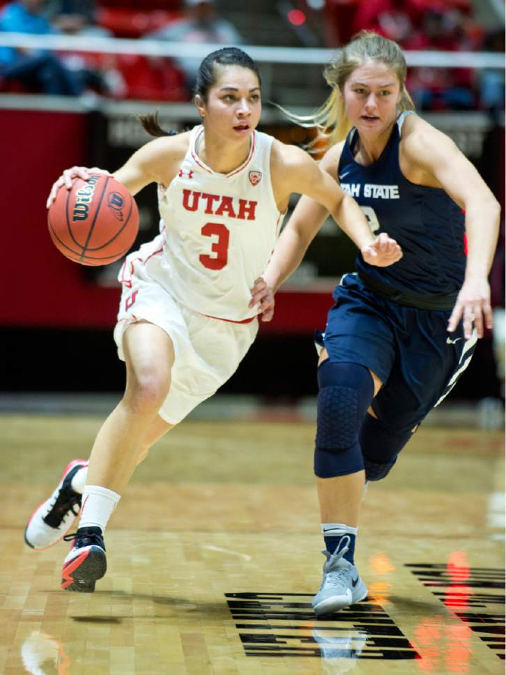 Lennie Mahler  |  The Salt Lake Tribune

Utah's Malia Nawahine brings the ball up the court as Utah State's Jessie Geer defends in a game at the Huntsman Center in Salt Lake City, Saturday, Dec. 3, 2016.