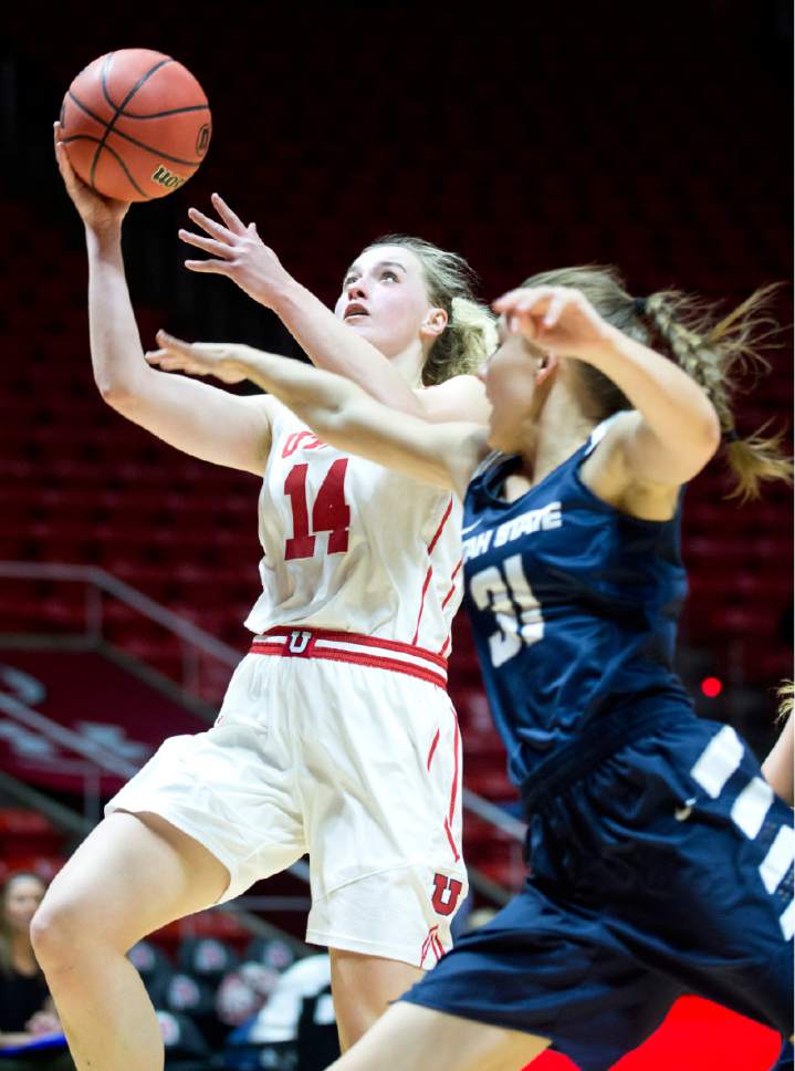 Lennie Mahler  |  The Salt Lake Tribune

Utah's Paige Crozon shoots over Utah State's Katie Toole in a game at the Huntsman Center in Salt Lake City, Saturday, Dec. 3, 2016.