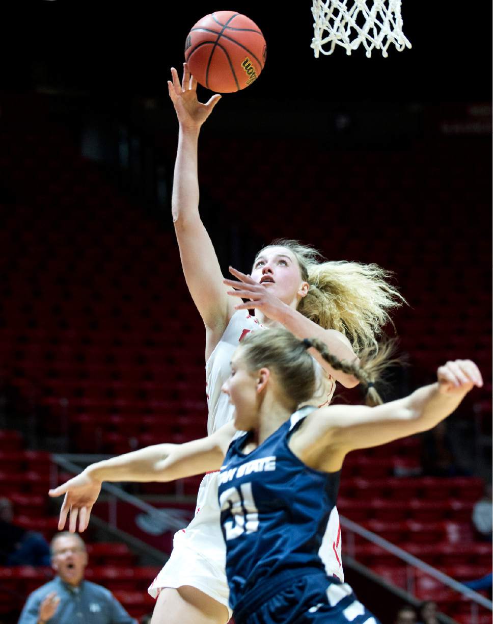 Lennie Mahler  |  The Salt Lake Tribune

Utah's Paige Crozon shoots over Utah State's Katie Toole in a game at the Huntsman Center in Salt Lake City, Saturday, Dec. 3, 2016.