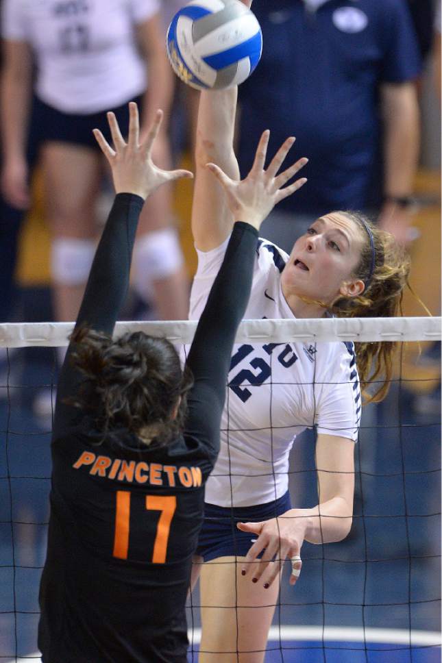Leah Hogsten  |  The Salt Lake Tribune
BYU outside hitter Veronica Jones-Perry (12) fires one over Princeton middle blocker Maggie O'Connell (17). Brigham Young University women's volleyball team defeated Princeton 3-0 during the first round of the NCAA tournament Friday, December 2, 2016 on the campus of Brigham Young University.