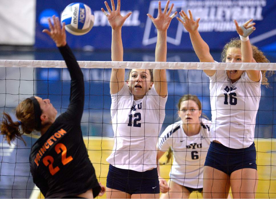 Leah Hogsten  |  The Salt Lake Tribune
BYU outside hitter Veronica Jones-Perry (12) and BYU middle blocker Whitney Young Howard (16) aim to block Princeton outside hitter Cara Mattaliano (22). Brigham Young University women's volleyball team defeated Princeton 3-0 during the first round of the NCAA tournament Friday, December 2, 2016 on the campus of Brigham Young University.