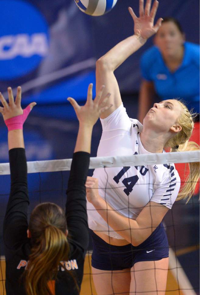 Leah Hogsten  |  The Salt Lake Tribune
BYU outside hitter Mckenna Miller (14) fires one over the net. Brigham Young University women's volleyball team defeated Princton 3-0 during the first round of the NCAA tournament Friday, December 2, 2016 on the campus of Brigham Young University.