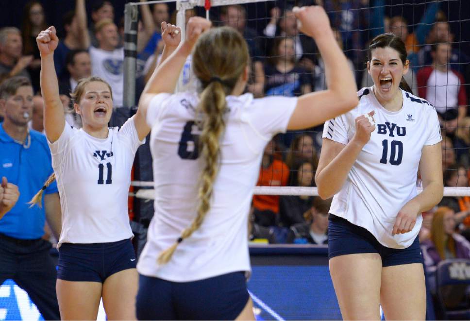 Leah Hogsten  |  The Salt Lake Tribune
BYU outside hitter Lacy Haddock (11) and BYU middle blocker Amy Boswell (10) celebrate BYU setter Lyndie Haddock (6) kill. Brigham Young University women's volleyball team defeated Princton 3-0 during the first round of the NCAA tournament Friday, December 2, 2016 on the campus of Brigham Young University.