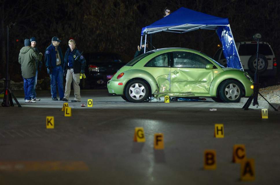 Francisco Kjolseth | The Salt Lake Tribune
Multiple bullet holes speckle the side of a VW in the far end of the Walmart parking lot, where a woman was shot and killed on Sunday night, Dec. 4, 2016. The suspect was soon pursued to the nearby Cinemark, where officers fired at the suspect when he refused to drop his weapon. The supect died at the scene, but police say he may have shot himself.
