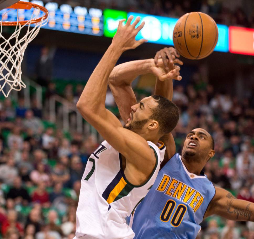 Lennie Mahler  |  The Salt Lake Tribune

Utah Jazz center Rudy Gobert draws a foul from Denver's Darrell Arthur in the first half of a game at Vivint Smart Home Arena in Salt Lake City, Saturday, Dec. 3, 2016.