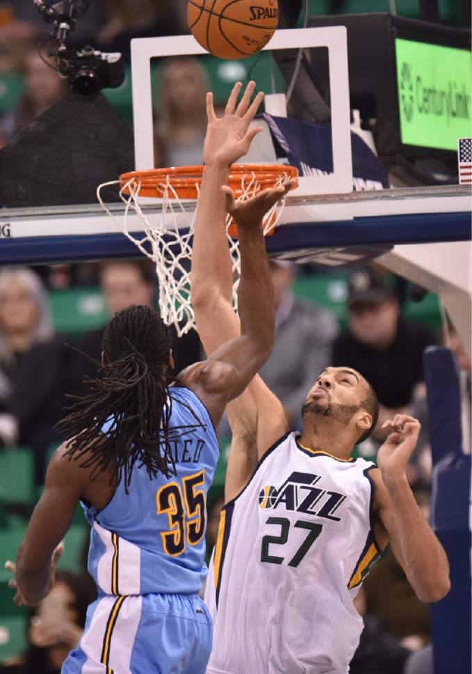 Lennie Mahler  |  The Salt Lake Tribune

Utah Jazz center Rudy Gobert blocks a shot by Denver's Kenneth Faried in the first half of a game at Vivint Smart Home Arena in Salt Lake City, Saturday, Dec. 3, 2016.