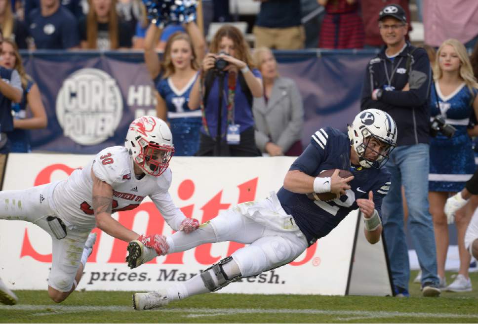 Leah Hogsten  |  The Salt Lake Tribune
Brigham Young Cougars quarterback Tanner Mangum (12) tries to dive into the end zone but comes up short. Brigham Young University defeated Southern Utah University 37-7 during their first match up at LaVell Edwards Stadium,  Saturday, November 12, 2016.