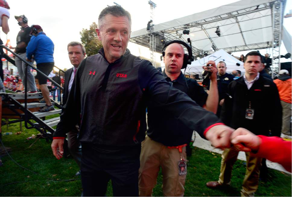 Scott Sommerdorf   |  The Salt Lake Tribune  
After doing an interview with ESPN's Samantha Ponder, Utah head coach Kyle Whittingham gives a fist bump to a young Utah fan during the ESPN College Gameday broadcast at President's Circle on the University of Utah campus, Saturday, October 29, 2016.