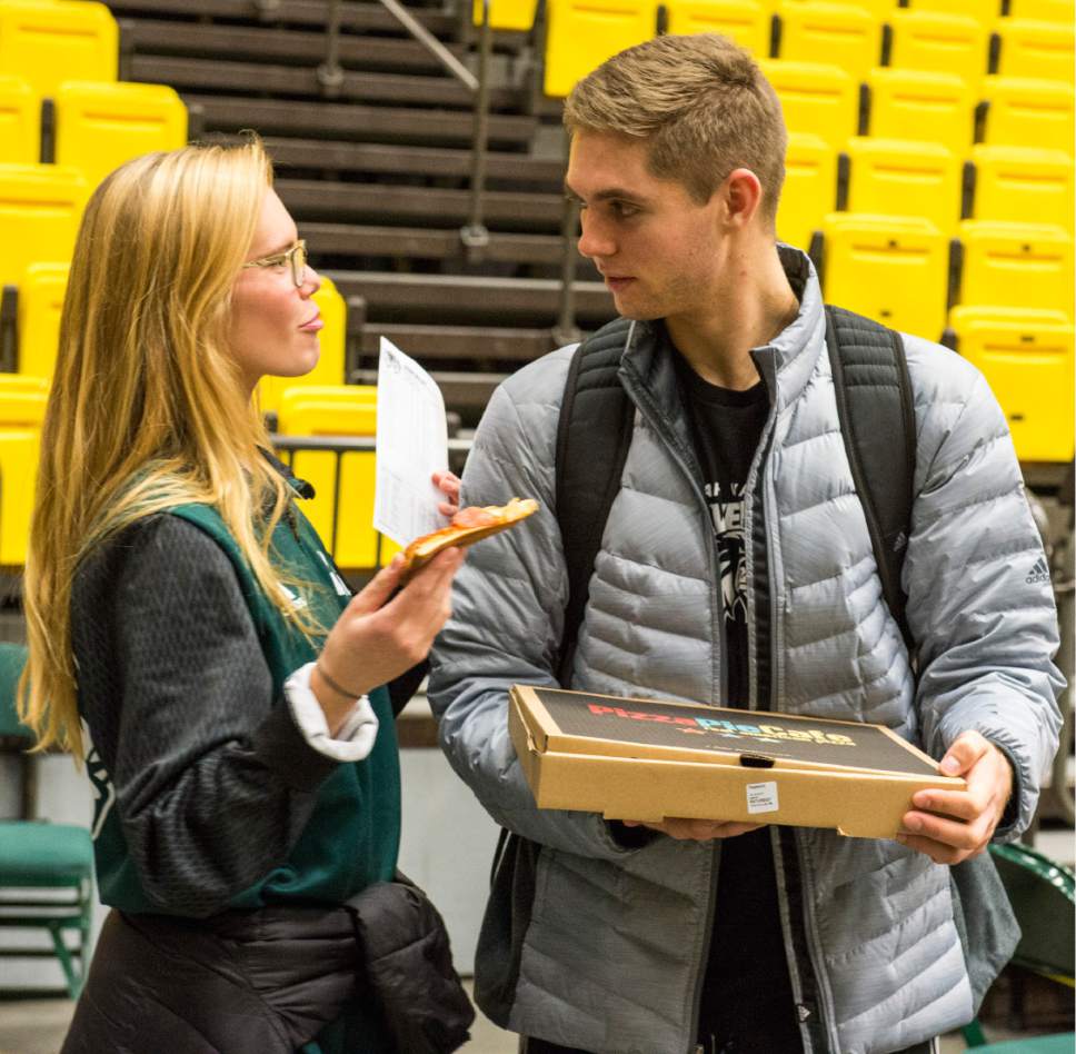 Rick Egan  |  The Salt Lake Tribune

Utah Valley guard Conner Toolson shares a piece of pizza with his wife Kenna, after the Wolverines 75-71 victory over the Texas-San Antonio Roadrunners, in Orem, Saturday, December 3, 2016.