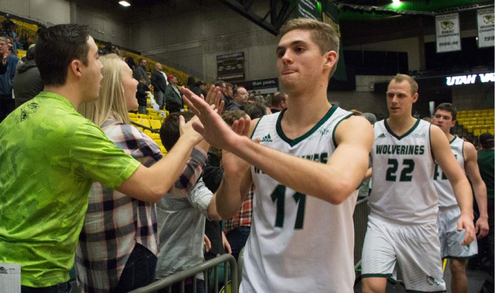 Rick Egan  |  The Salt Lake Tribune

Utah Valley Wolverines guard Conner Toolson (11) and Isaac Neilson (22), high-five fans, after the Wolverines 75-71 victory over the Texas-San Antonio Roadrunners, in Orem, Saturday, December 3, 2016.