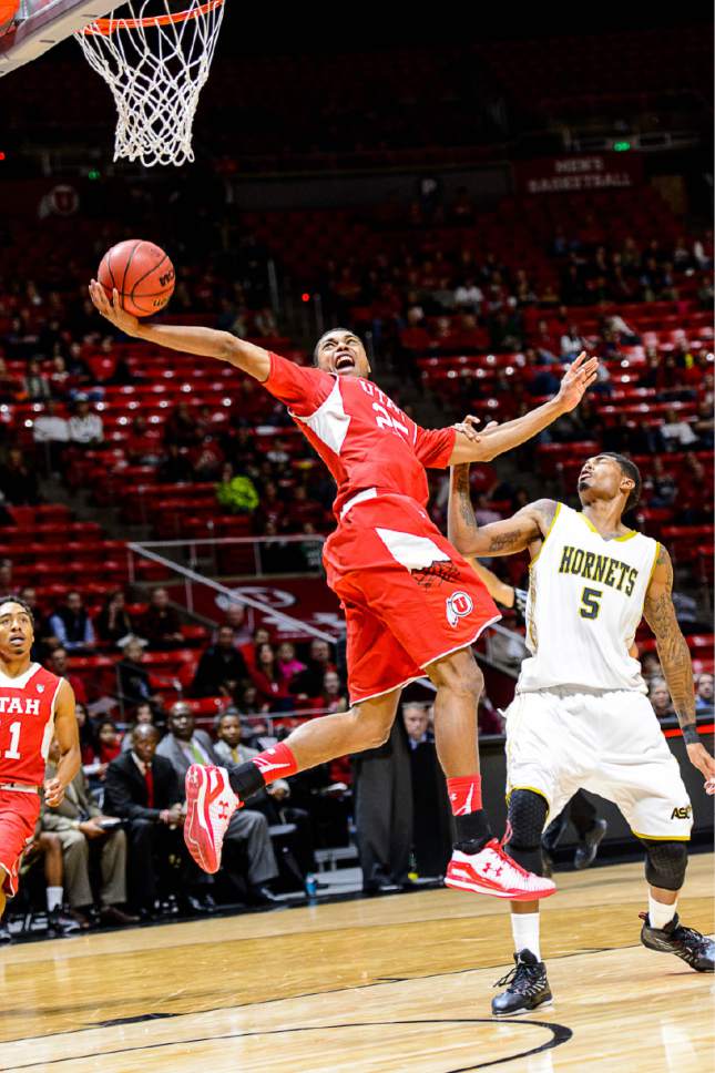 Trent Nelson  |  The Salt Lake Tribune
Utah Utes guard Kenneth Ogbe (25) sinks an incredible shot as he's fouled by Alabama State Hornets guard Bobby Brown (5). University of Utah Utes host the Alabama State Hornets, college basketball at the Huntsman Center in Salt Lake City, Saturday November 29, 2014.