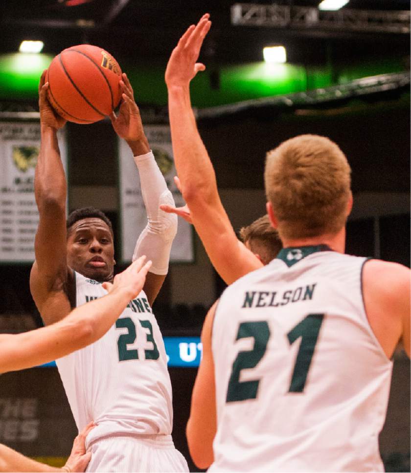 Rick Egan  |  The Salt Lake Tribune

Utah Valley Wolverines guard Brandon Randolph (23) tosses a pass to Zach Nelson (21), in basketball action, Utah Valley Wolverines vs. the Texas-San Antonio Roadrunners, at the UCCU Center, in Orem, Saturday, December 3, 2016.