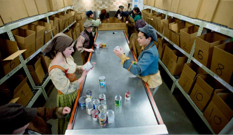 Steve Griffin | The Salt Lake Tribune


Performers from Pioneer Theatre Company's production of "Oliver!" sort food after they performed a song from the play at the Utah Food Bank in Salt Lake City on Monday, Dec. 5, 2016 Charles Dickens' "Oliver" is about a fearless orphan in search of love and his next meal and forced into a life of pick-pocketing. Patrons of Pioneer Theatre Company's family production will be bringing food donations to the shows throughout its run through Dec. 17, 2016.