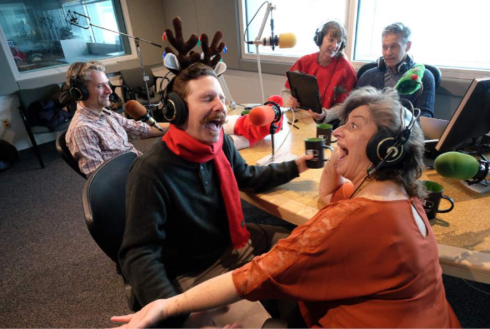 Francisco Kjolseth | The Salt Lake Tribune
Voice actors Jay Perry, and Teresa Sanderson have some fun at KUER's RadioWest in anticipation of Plan-B Theatre Companyís upcoming 11th radio hour, "Yuletide." The one-hour broadcast will be performed live on the radio on Thursday, Dec. 8, 2016.. Also pictured in background are writer Matthew Ivan Bennett, director Cheryl Cluff and Radio West host Doug Fabrizio, from left.
