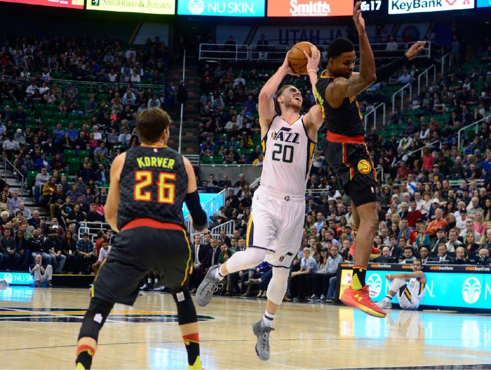 Scott Sommerdorf   |  The Salt Lake Tribune  
Utah Jazz forward Gordon Hayward (20) is fouled as he goes up to shoot during first half pay. The Jazz held a 40-30 lead over the Atlanta Hawks during first half play, Friday November 25, 2016.